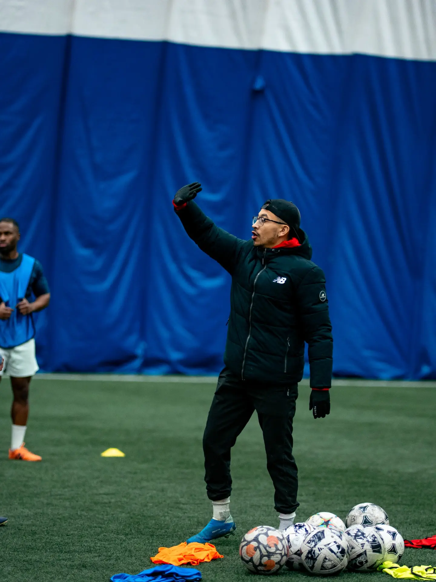 Coach addressing players at an Inter Ottawa training session