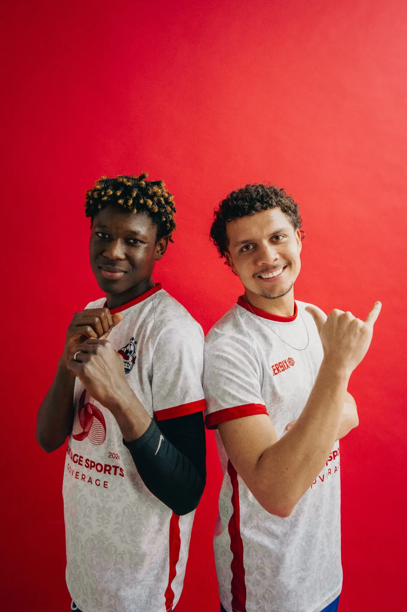 Two Inter Ottawa players smiling against a red background