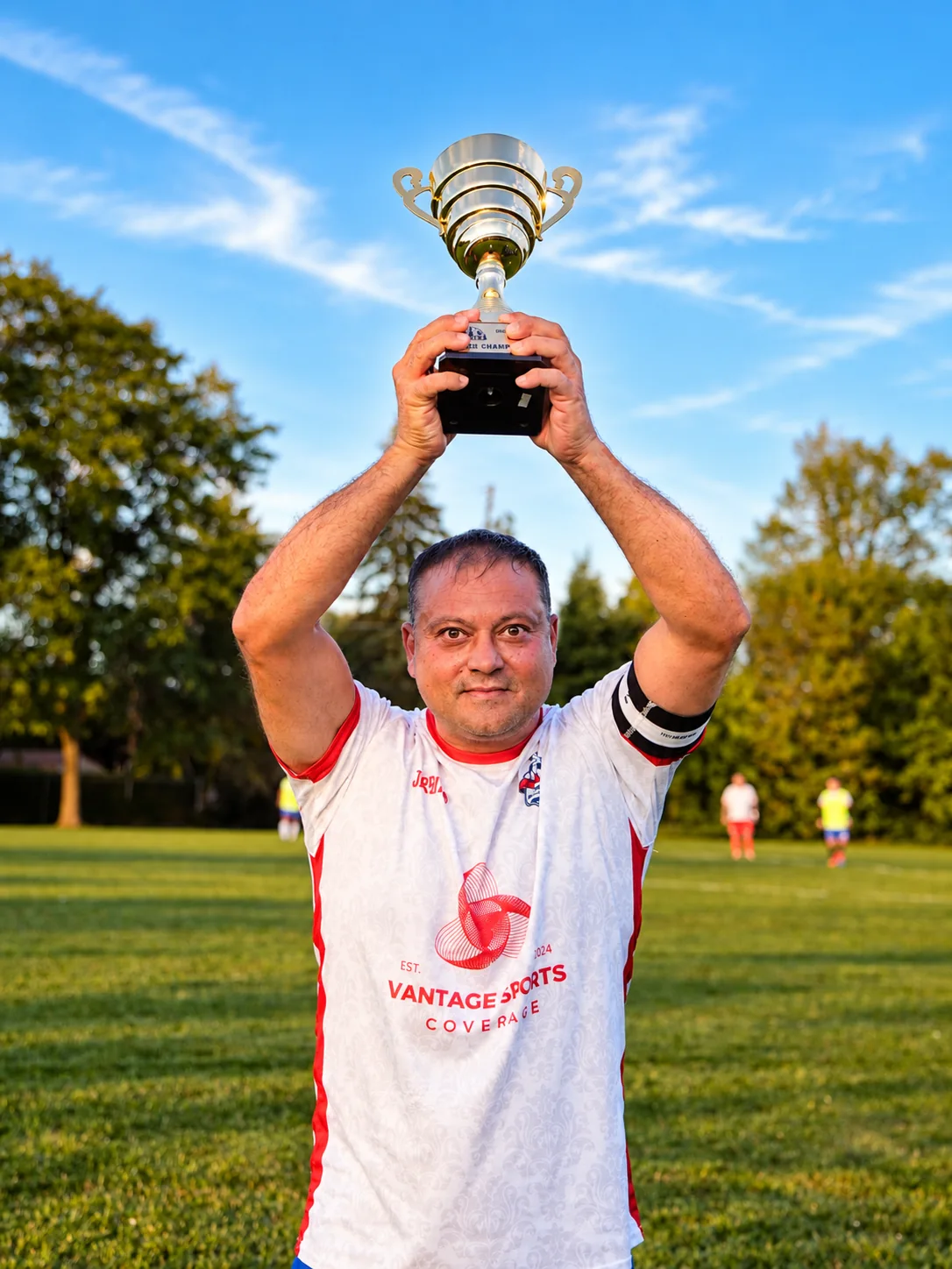 An Inter Ottawa OT3 player lifting the 2026 division trophy