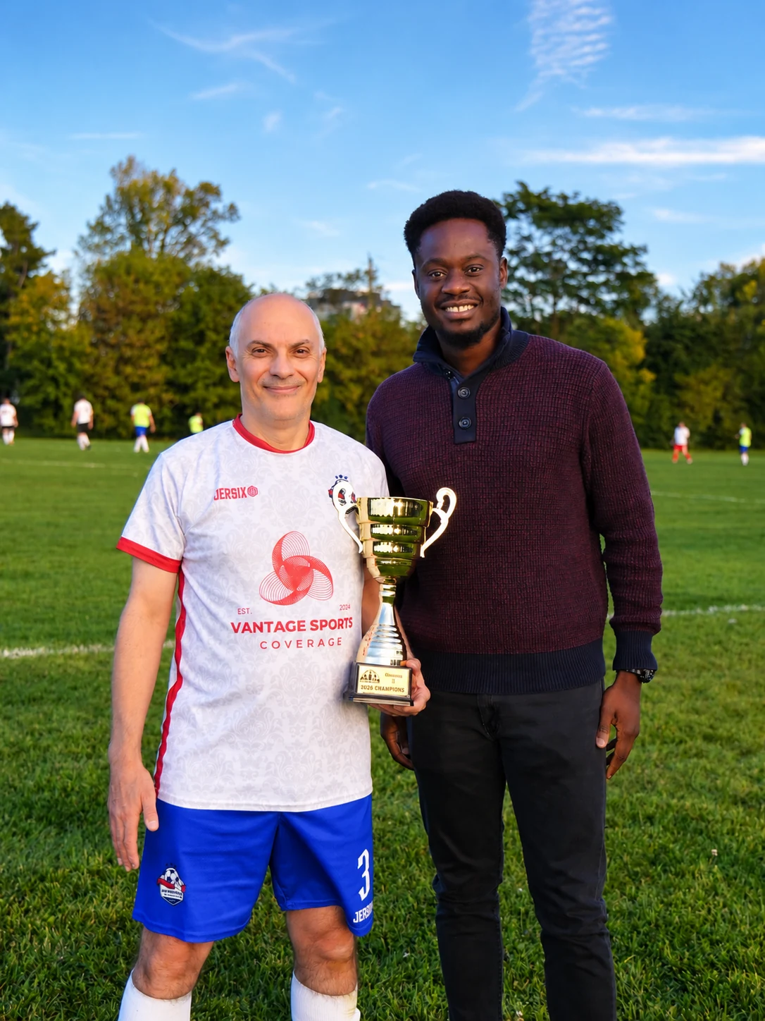 Aldo Martino and Efosa Ogbeifun with the 2026 OT3 championship trophy