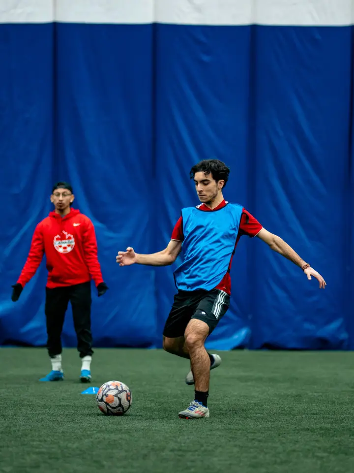 Player striking the ball during an indoor recreational session